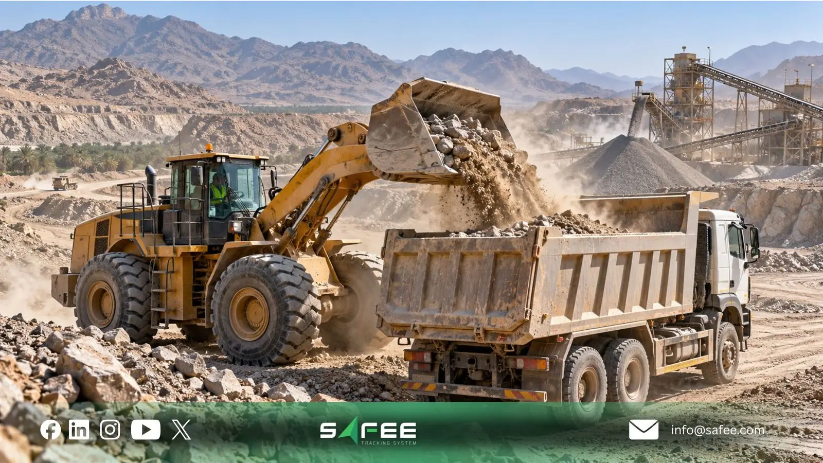 Wheel loader filling a dump truck at a quarry in Saudi Arabia